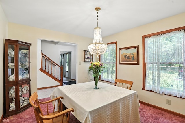 1224 S Hunter Rd, Indianapolis, IN 46239 - dining space with a chandelier, stairs, and carpet