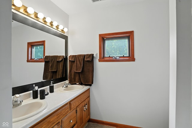 1224 S Hunter Rd, Indianapolis, IN 46239 - full bath with double vanity and baseboards