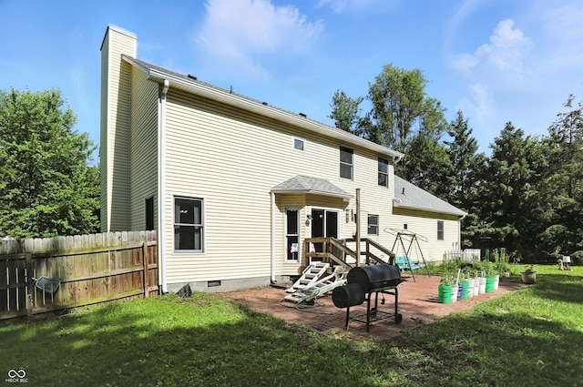 1224 S Hunter Rd, Indianapolis, IN 46239 - rear view of property featuring a chimney, a patio area, and crawl space