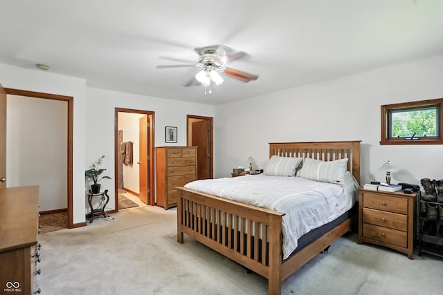 1224 S Hunter Rd, Indianapolis, IN 46239 - bedroom featuring light colored carpet, a ceiling fan, and ensuite bathroom