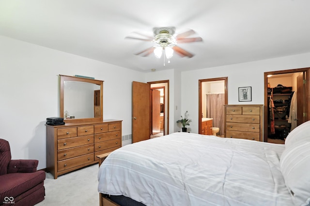 1224 S Hunter Rd, Indianapolis, IN 46239 - bedroom with light carpet, a spacious closet, ensuite bath, a closet, and a ceiling fan