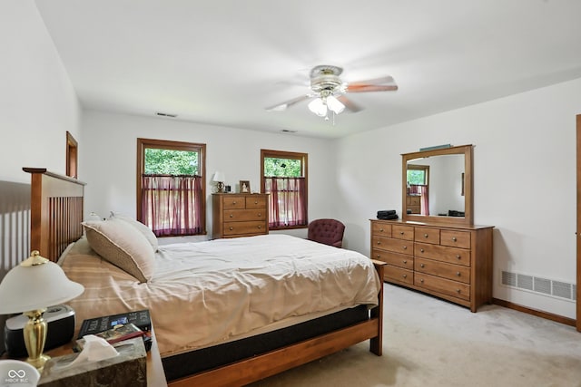 1224 S Hunter Rd, Indianapolis, IN 46239 - bedroom with light colored carpet and a ceiling fan