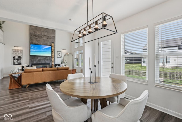 1414 W Springhurst Blvd, Greenfield, IN 46140 - dining area with dark wood-style floors and a fireplace