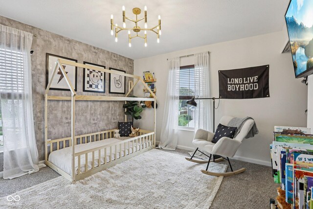 1414 W Springhurst Blvd, Greenfield, IN 46140 - carpeted bedroom featuring a chandelier and baseboards