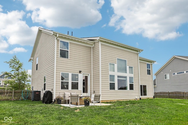 1414 W Springhurst Blvd, Greenfield, IN 46140 - back of house with an outdoor living space, a fenced backyard, and a patio area