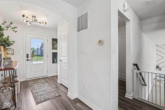 1414 W Springhurst Blvd, Greenfield, IN 46140 - foyer with arched walkways, dark wood-style flooring, and a chandelier