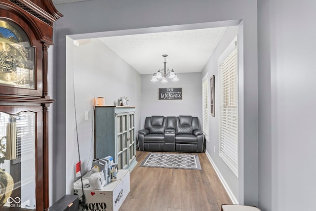 401 N Nicole Ln, Scottsburg, IN 47170 - living room featuring light wood-style floors and a chandelier