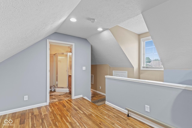 401 N Nicole Ln, Scottsburg, IN 47170 - additional living space with a textured ceiling, wood finished floors, lofted ceiling, and recessed lighting