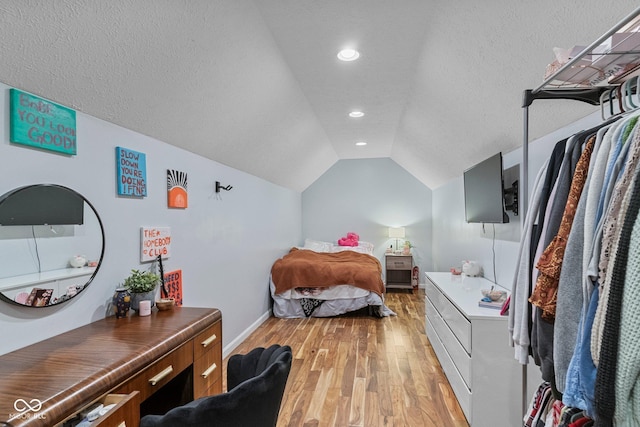 401 N Nicole Ln, Scottsburg, IN 47170 - bedroom featuring light wood-type flooring, lofted ceiling, recessed lighting, and a textured ceiling