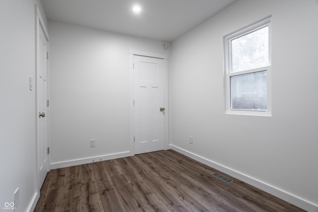 4245 Norwaldo Ave, Indianapolis, IN 46205 - spare room featuring dark wood-style flooring and baseboards