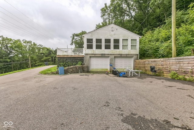 8783 State Road 56, Aurora, IN 47001 - view of front of house featuring a garage and a deck