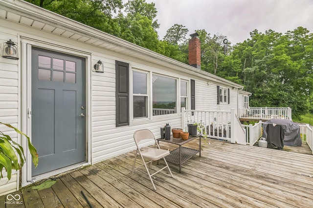 8783 State Road 56, Aurora, IN 47001 - deck featuring view of scattered trees and a grill
