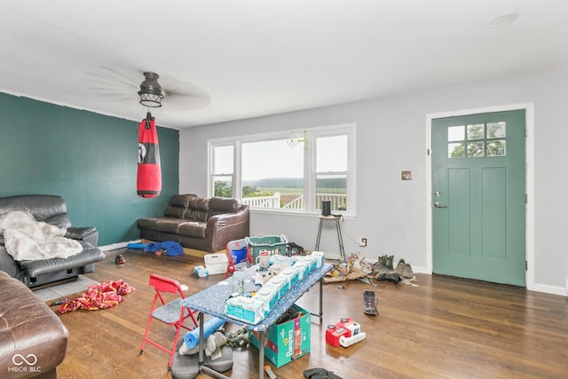 8783 State Road 56, Aurora, IN 47001 - living area featuring healthy amount of natural light, wood finished floors, and ceiling fan