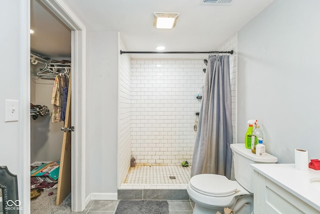 8783 State Road 56, Aurora, IN 47001 - bathroom featuring a shower stall, vanity, a spacious closet, and tile patterned floors