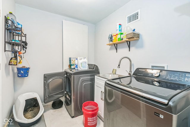 8783 State Road 56, Aurora, IN 47001 - laundry area with separate washer and dryer and cabinet space