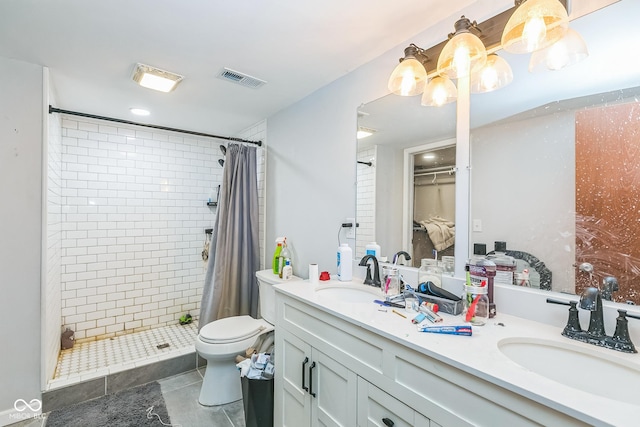 8783 State Road 56, Aurora, IN 47001 - full bath with a shower stall, double vanity, tile patterned flooring, and a walk in closet