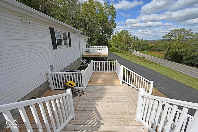 8783 State Road 56, Aurora, IN 47001 - wooden deck featuring view of scattered trees