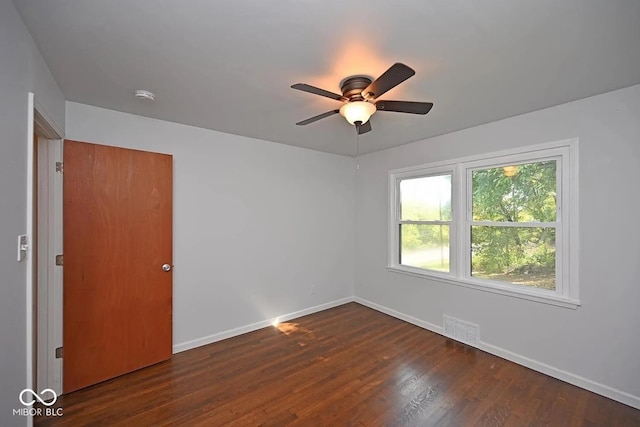 8783 State Road 56, Aurora, IN 47001 - empty room with a smoke detector, a ceiling fan, and dark wood-style flooring