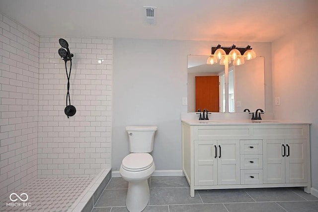 8783 State Road 56, Aurora, IN 47001 - bathroom featuring tiled shower, double vanity, and tile patterned flooring