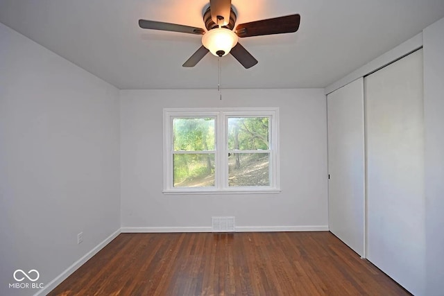 8783 State Road 56, Aurora, IN 47001 - unfurnished bedroom featuring wood finished floors, a closet, and ceiling fan