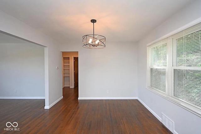 8783 State Road 56, Aurora, IN 47001 - empty room featuring a chandelier and dark wood finished floors