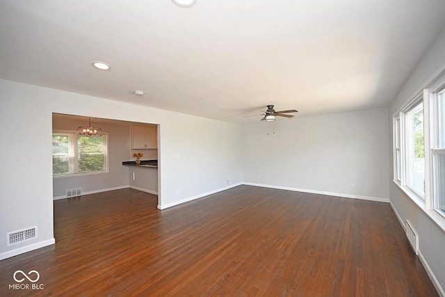 8783 State Road 56, Aurora, IN 47001 - unfurnished living room with dark wood-type flooring, plenty of natural light, a ceiling fan, and recessed lighting