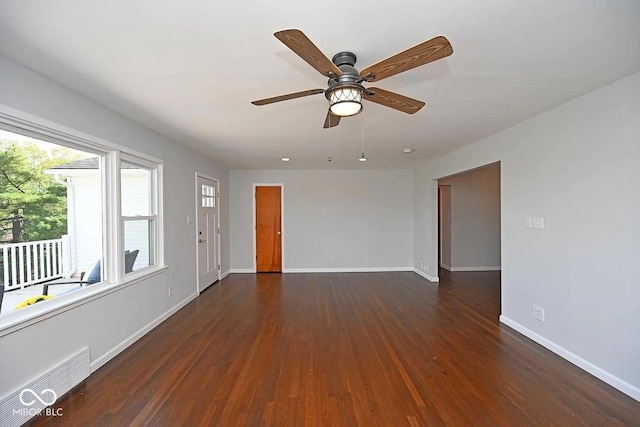 8783 State Road 56, Aurora, IN 47001 - unfurnished room featuring plenty of natural light, dark wood-type flooring, and a ceiling fan