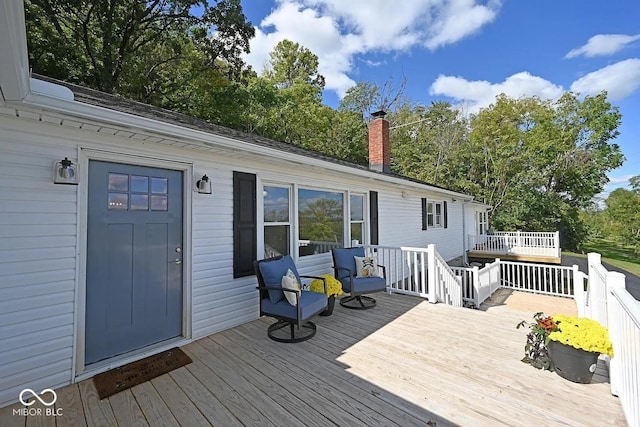 8783 State Road 56, Aurora, IN 47001 - wooden deck with view of scattered trees