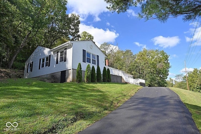 8783 State Road 56, Aurora, IN 47001 - view of property exterior with a yard and asphalt driveway