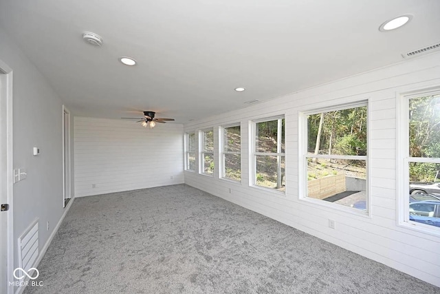 8783 State Road 56, Aurora, IN 47001 - unfurnished sunroom with healthy amount of natural light, carpet floors, recessed lighting, and wooden walls