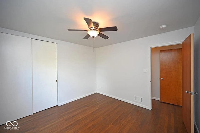 8783 State Road 56, Aurora, IN 47001 - unfurnished bedroom featuring wood finished floors, a closet, and ceiling fan