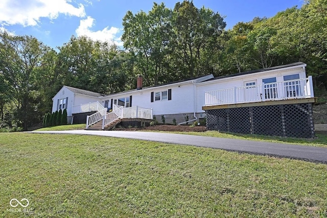 8783 State Road 56, Aurora, IN 47001 - manufactured / mobile home featuring a deck and a front yard