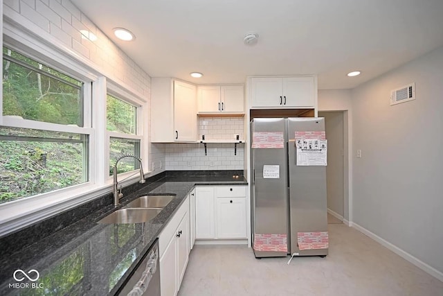 8783 State Road 56, Aurora, IN 47001 - kitchen featuring appliances with stainless steel finishes, white cabinets, backsplash, dark stone counters, and recessed lighting