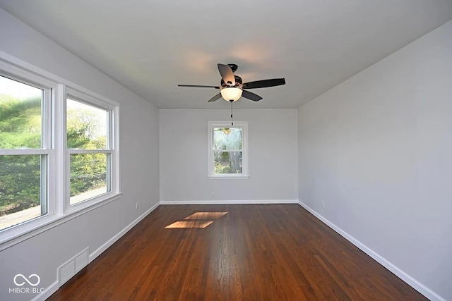 8783 State Road 56, Aurora, IN 47001 - spare room featuring dark wood-type flooring and ceiling fan