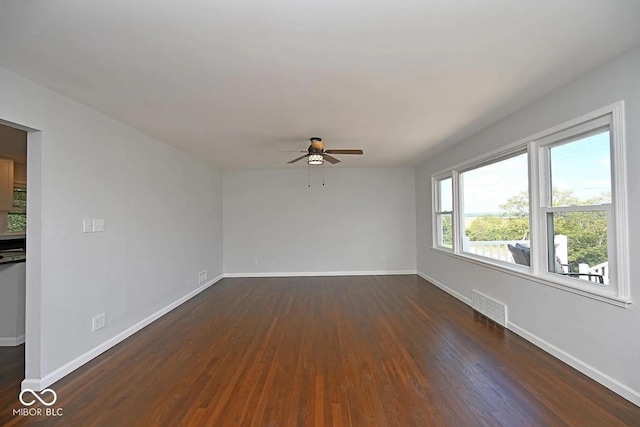 8783 State Road 56, Aurora, IN 47001 - spare room featuring ceiling fan and dark wood finished floors