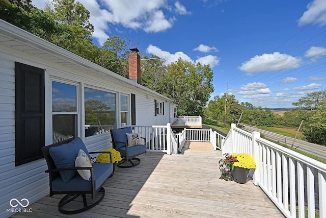 8783 State Road 56, Aurora, IN 47001 - wooden deck with view of scattered trees