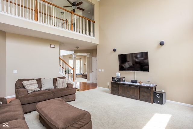 1521 Midnight Pass, Brownsburg, IN 46112 - living area with ceiling fan, carpet floors, decorative columns, stairs, and a towering ceiling