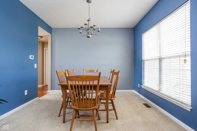 1521 Midnight Pass, Brownsburg, IN 46112 - carpeted dining room featuring a chandelier and healthy amount of natural light