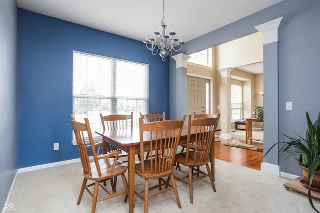 1521 Midnight Pass, Brownsburg, IN 46112 - dining space with decorative columns, a chandelier, and carpet floors