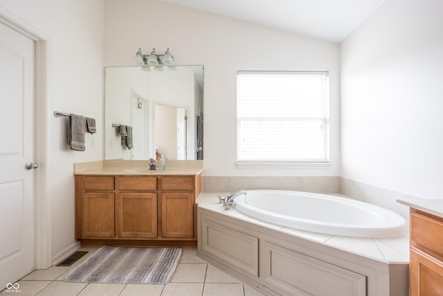 1521 Midnight Pass, Brownsburg, IN 46112 - bathroom with vanity, vaulted ceiling, a garden tub, and tile patterned flooring