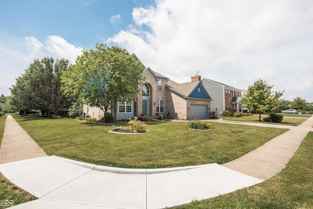 1521 Midnight Pass, Brownsburg, IN 46112 - view of front of house with driveway, a front yard, brick siding, and a chimney