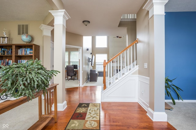 1521 Midnight Pass, Brownsburg, IN 46112 - entryway with decorative columns, wood finished floors, and stairs