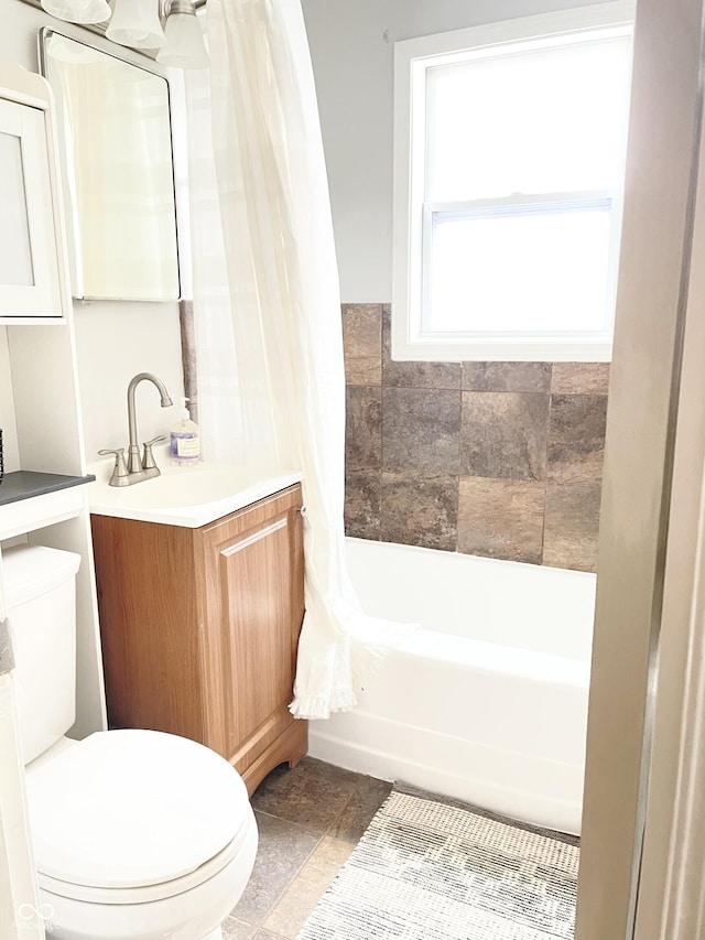 1940 N Drexel Ave, Indianapolis, IN 46218 - full bath with vanity, shower / tub combo, and stone finish floors