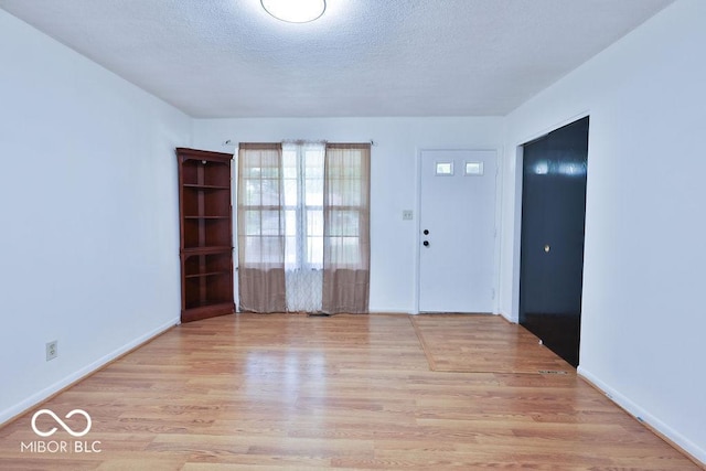 923 Bogalusa Ct, Indianapolis, IN 46217 - foyer entrance with wood finished floors and a textured ceiling
