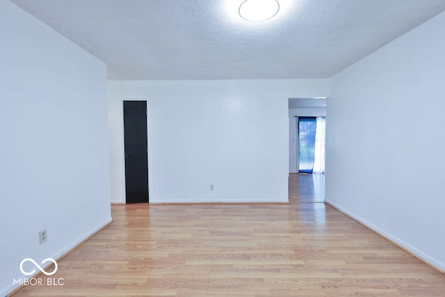 923 Bogalusa Ct, Indianapolis, IN 46217 - spare room with wood finished floors and a textured ceiling