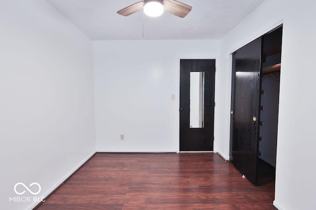923 Bogalusa Ct, Indianapolis, IN 46217 - unfurnished bedroom with wood finished floors, a closet, and a ceiling fan