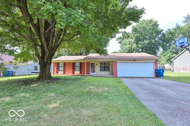 923 Bogalusa Ct, Indianapolis, IN 46217 - ranch-style home with a garage, driveway, a front lawn, and brick siding