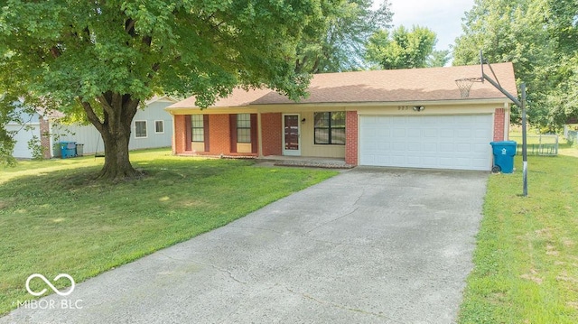 923 Bogalusa Ct, Indianapolis, IN 46217 - ranch-style home with asphalt driveway, an attached garage, and brick siding