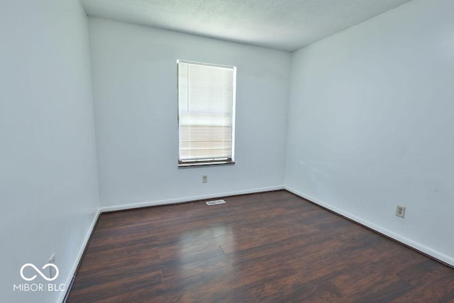 923 Bogalusa Ct, Indianapolis, IN 46217 - unfurnished room featuring dark wood finished floors