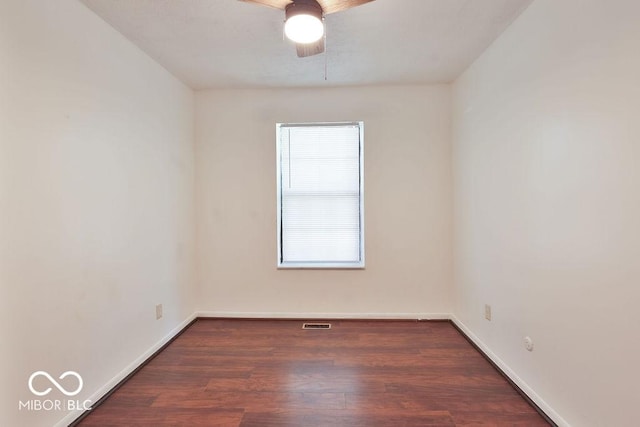 923 Bogalusa Ct, Indianapolis, IN 46217 - empty room with a ceiling fan and dark wood-style floors